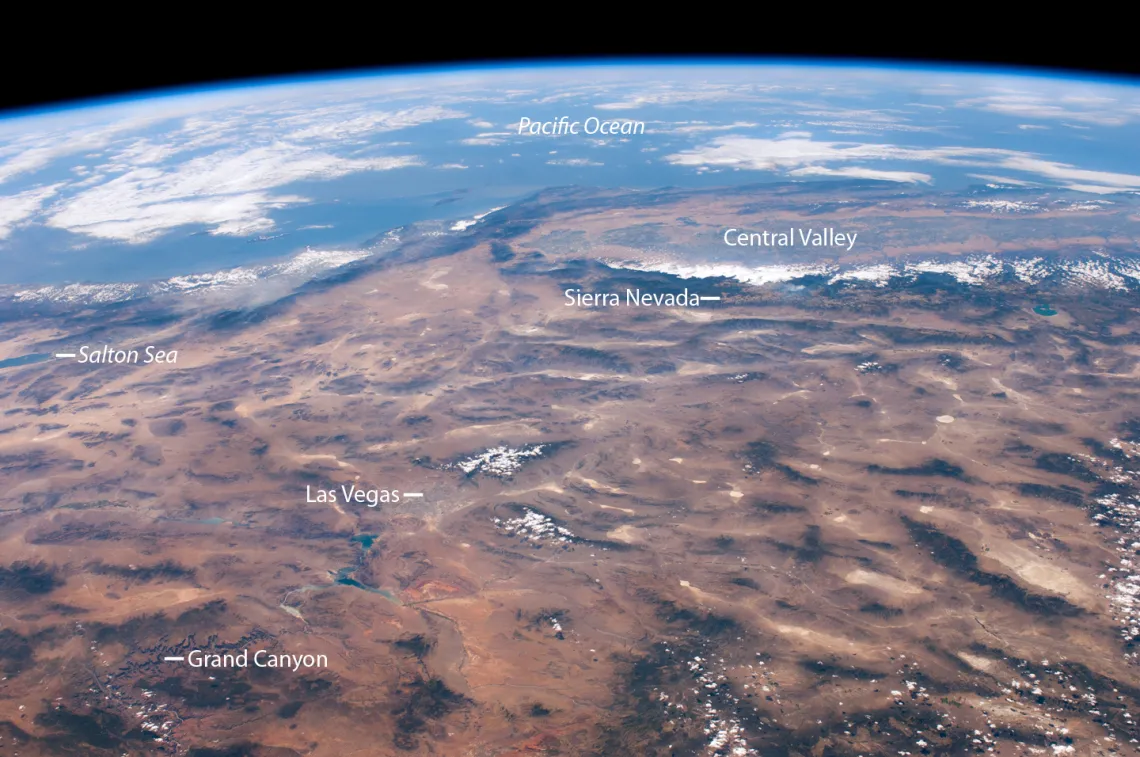 The region’s climate is highly varied and strongly influenced by topography, storm tracks, and proximity to oceans (seen here from space).